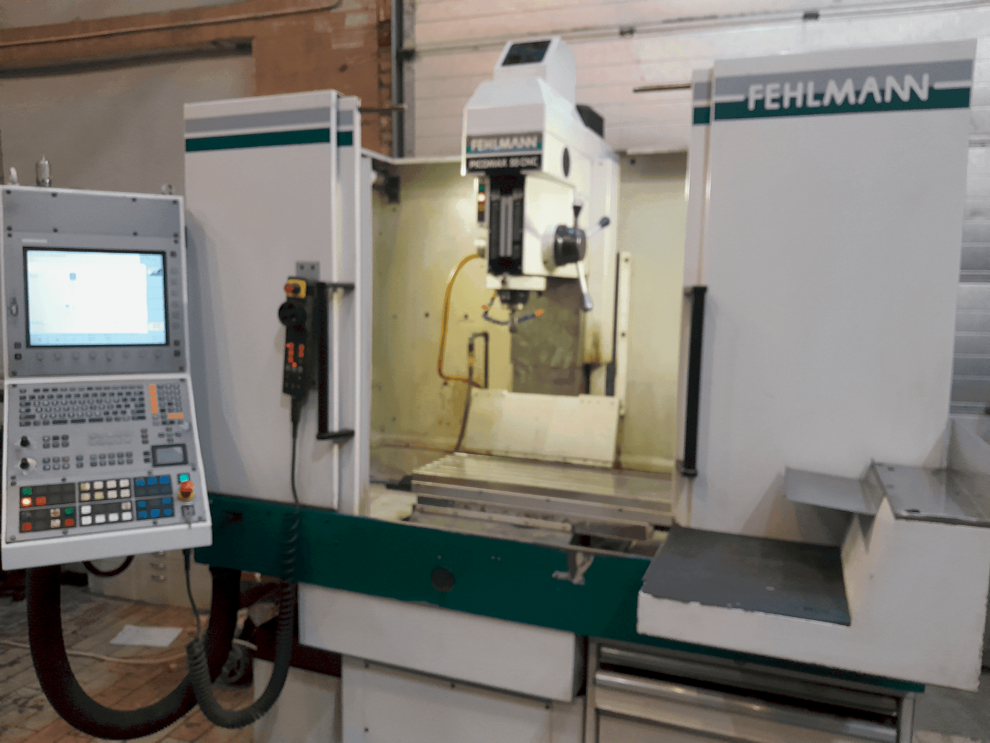 Koneen  FEHLMANN PICOMAX 55 CNC 2/3 etunäkymä