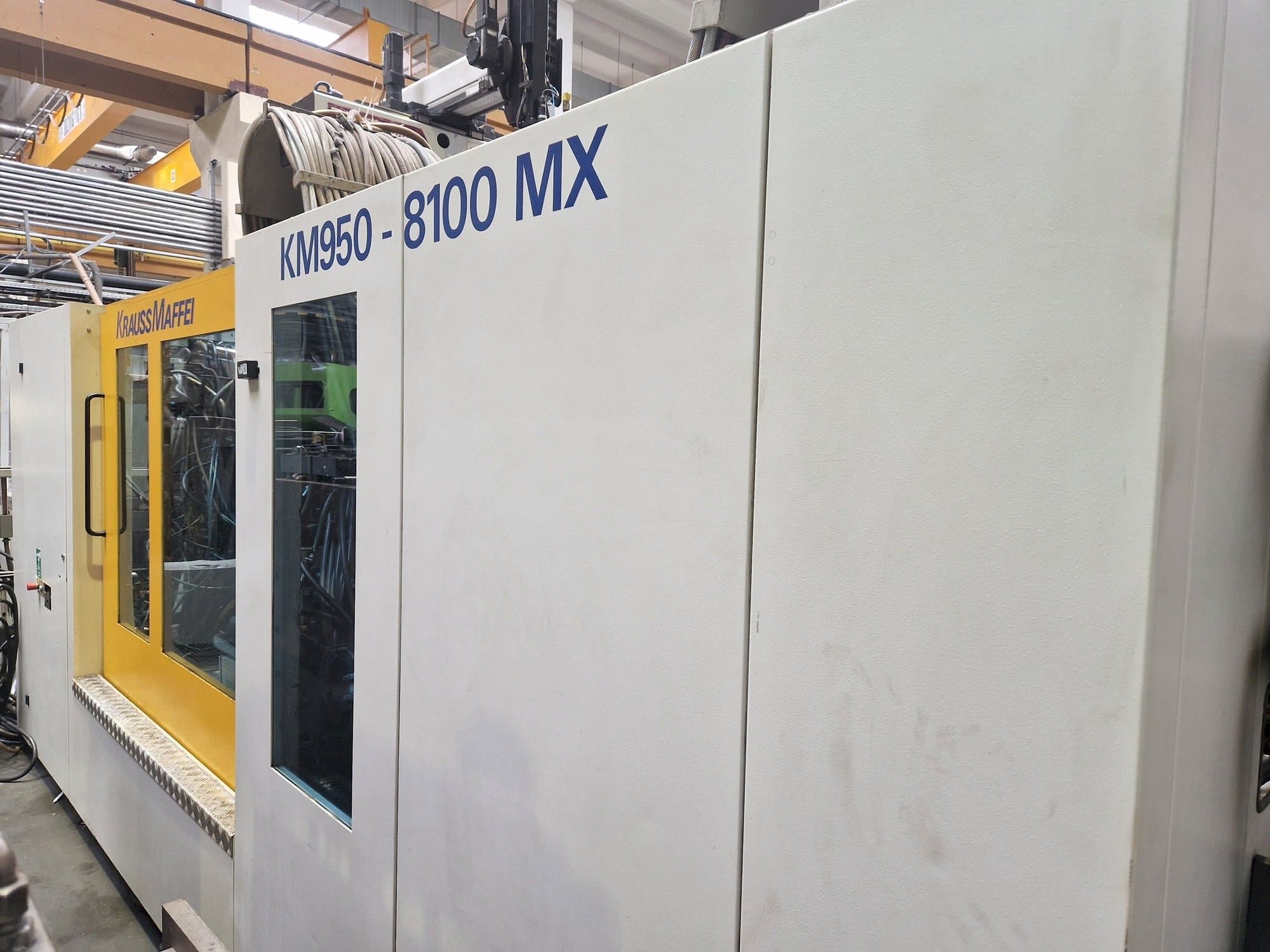 Koneen  Krauss Maffei 950-8100 MX etunäkymä
