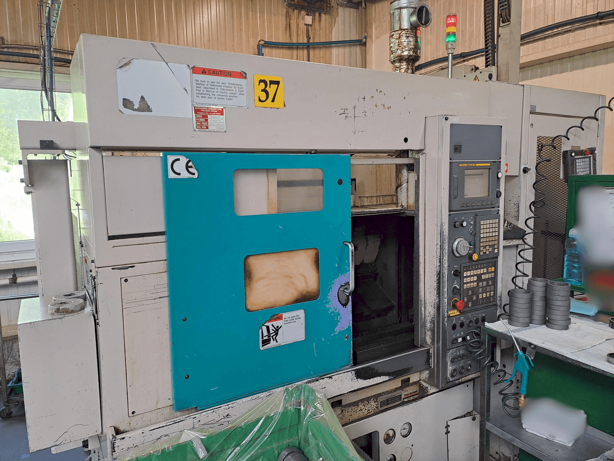 Koneen  Takisawa TC 200 etunäkymä