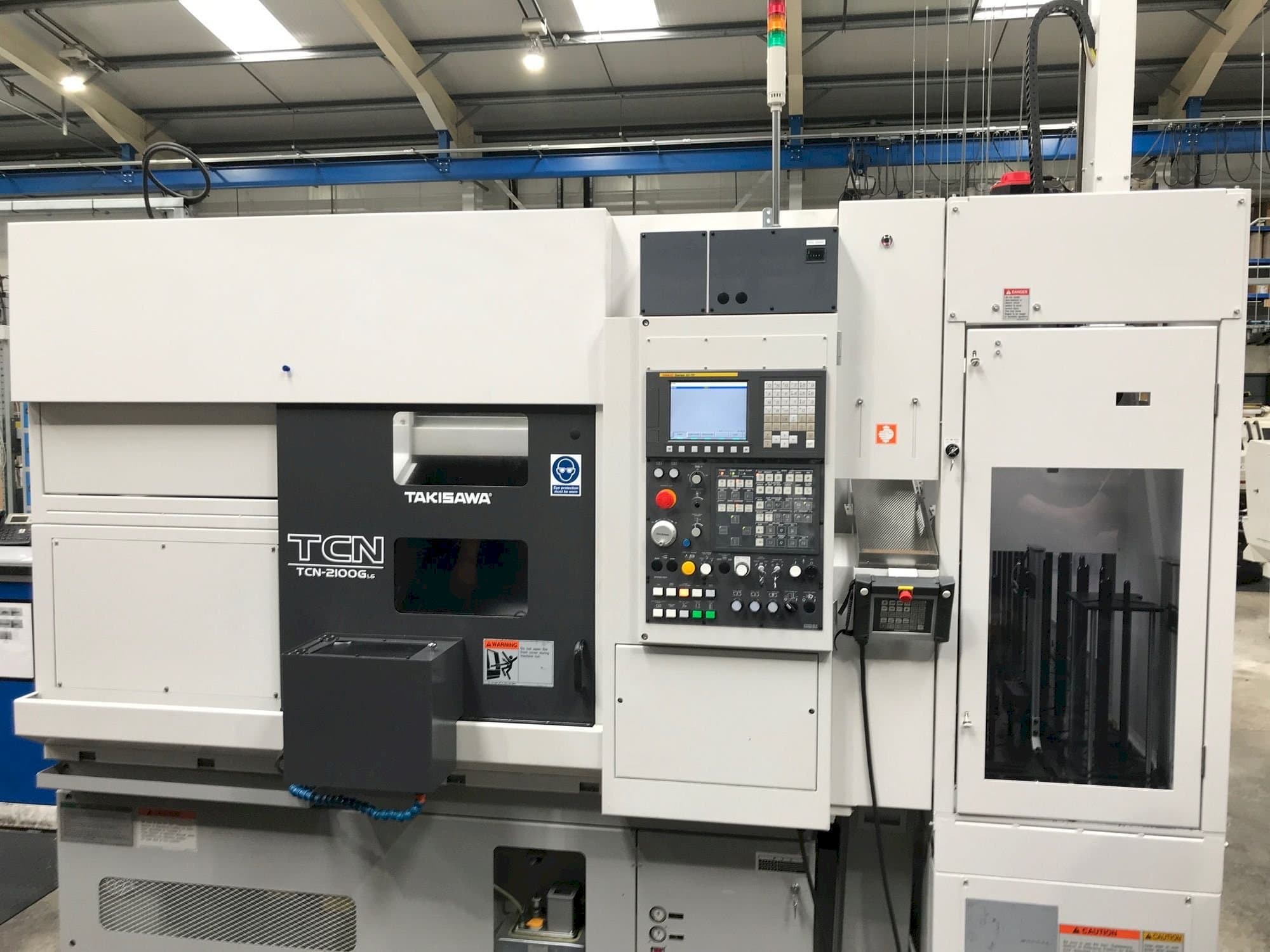 Koneen  Takisawa TCN-2100G L6 etunäkymä