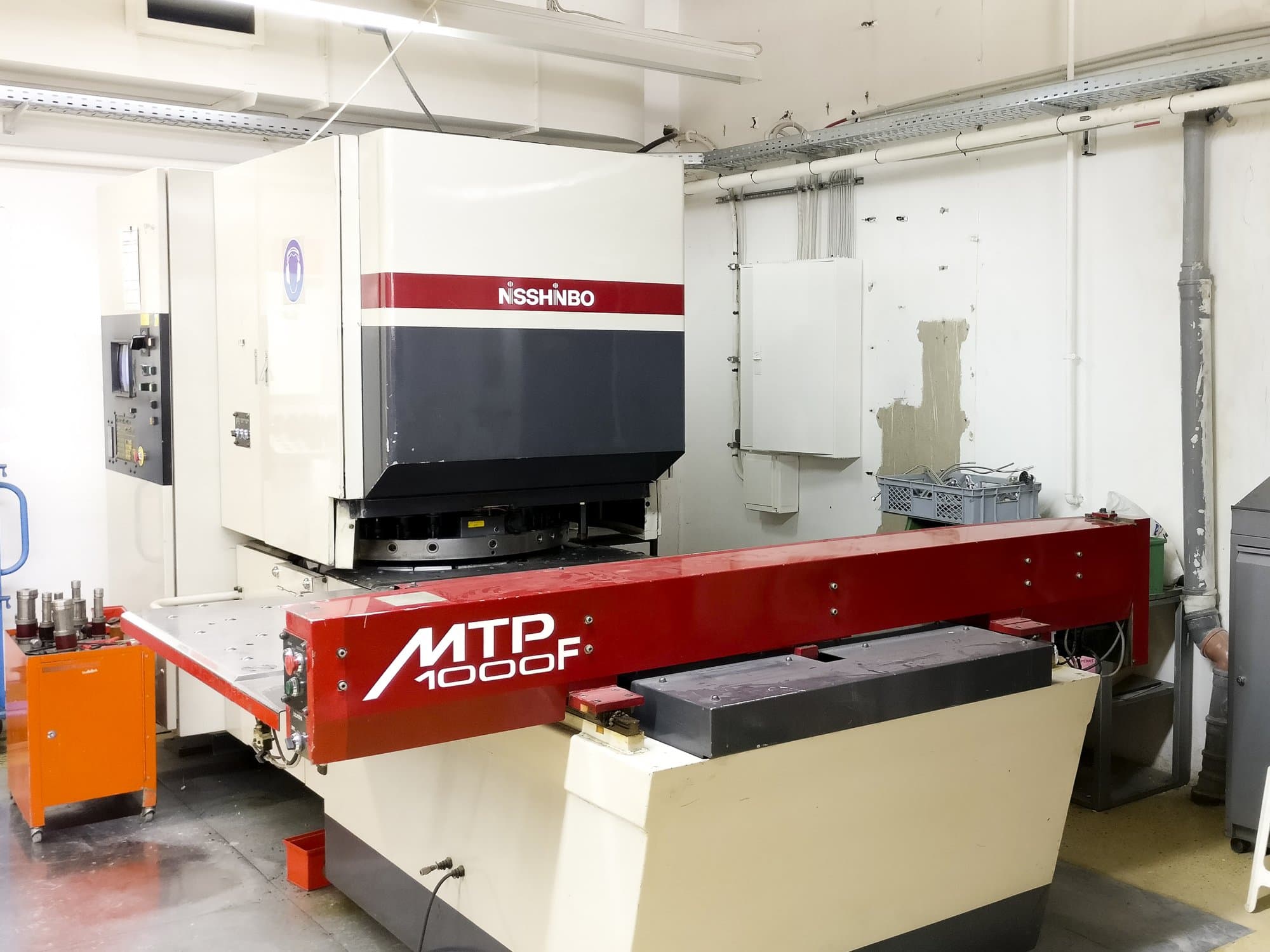 Koneen Nisshinbo MTP-1000F Vasen näkymä