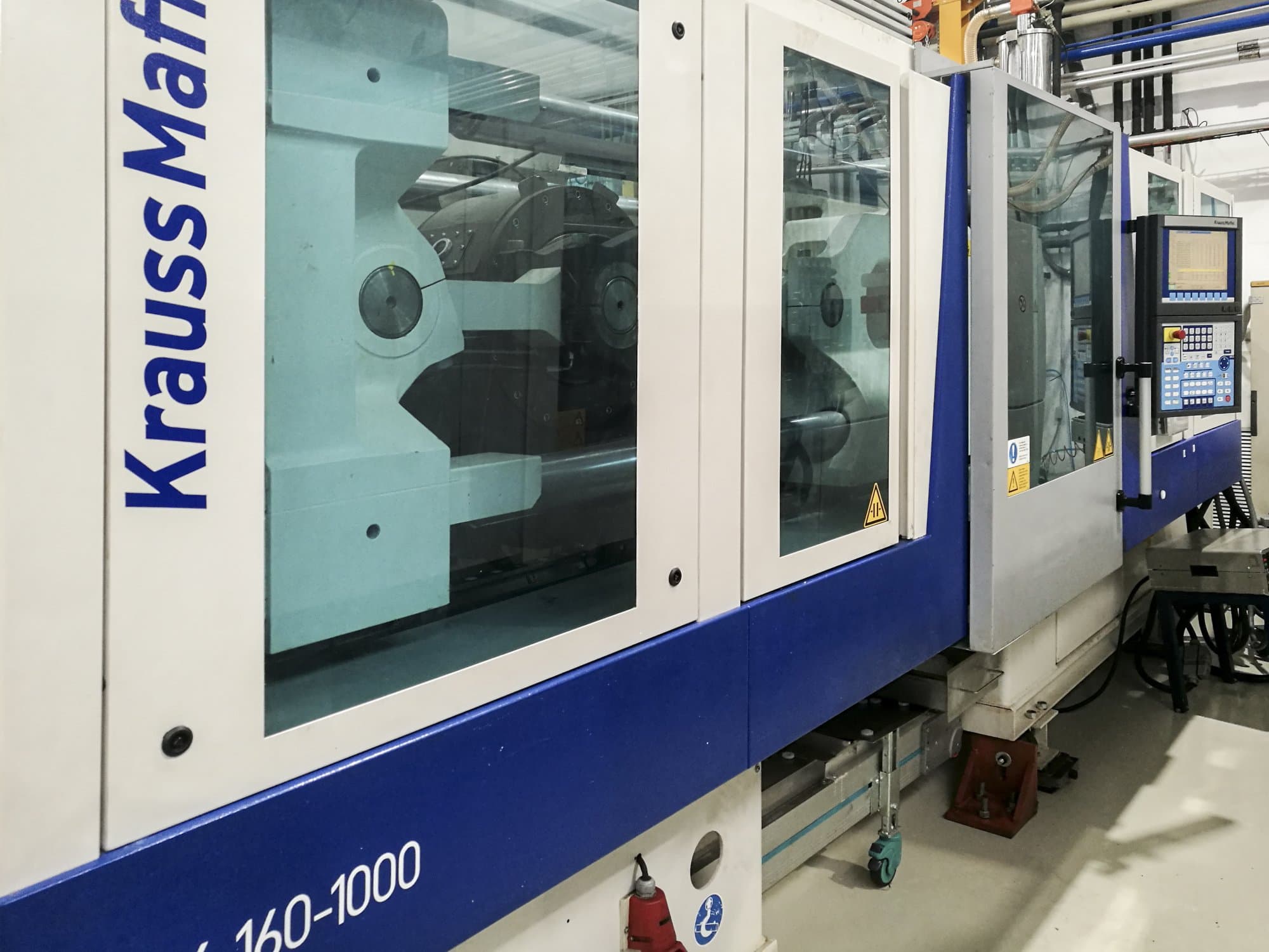 Koneen Krauss Maffei vasen näkymä160-1000 EX